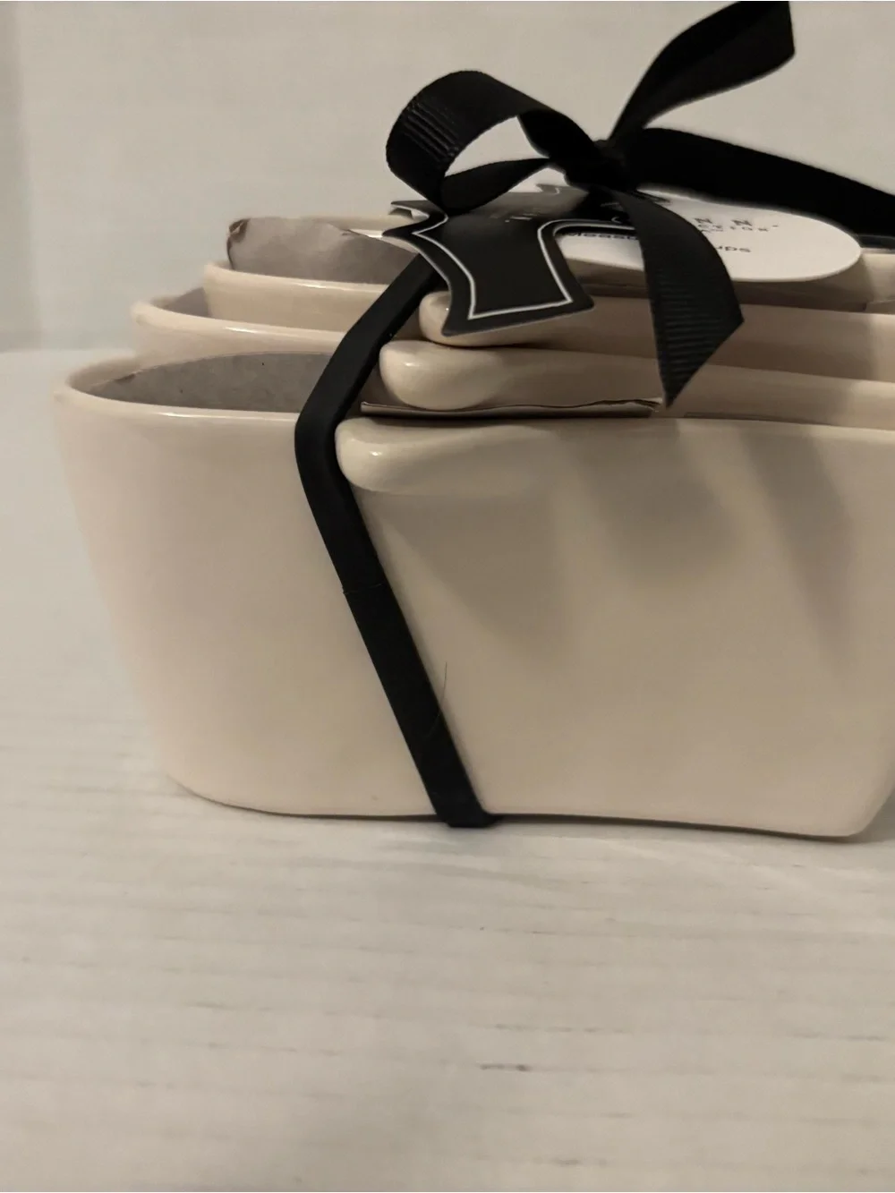 Rae Dunn Cream Ceramic Nested Measuring Cups with Black Ribbon